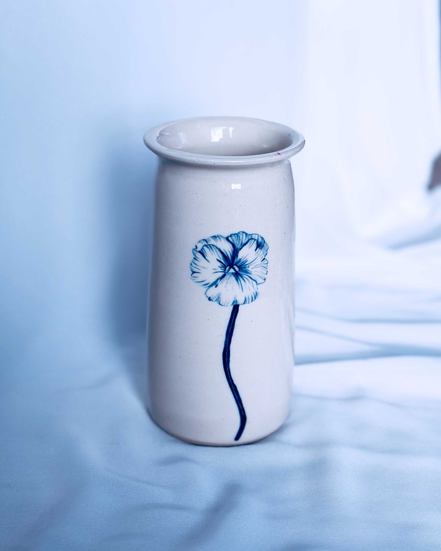 Illustrated floral ceramic vase on a white background