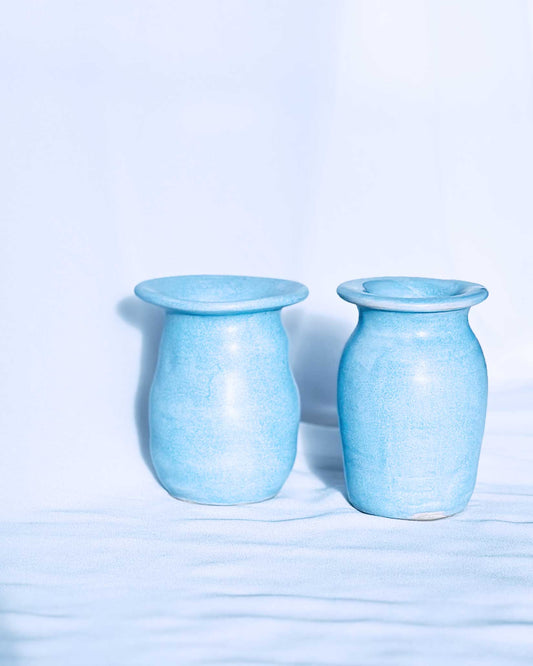Blue ceramic vases on white background